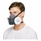 Dunkelgraue bls atemschutz-halbmaske 4100next mit schwarzen bändern und weißem filter der schutzklasse a2 p2 r
