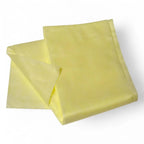 A pale yellow clendo staubbindetuch made of soft polypropylene folded neatly for dust removal