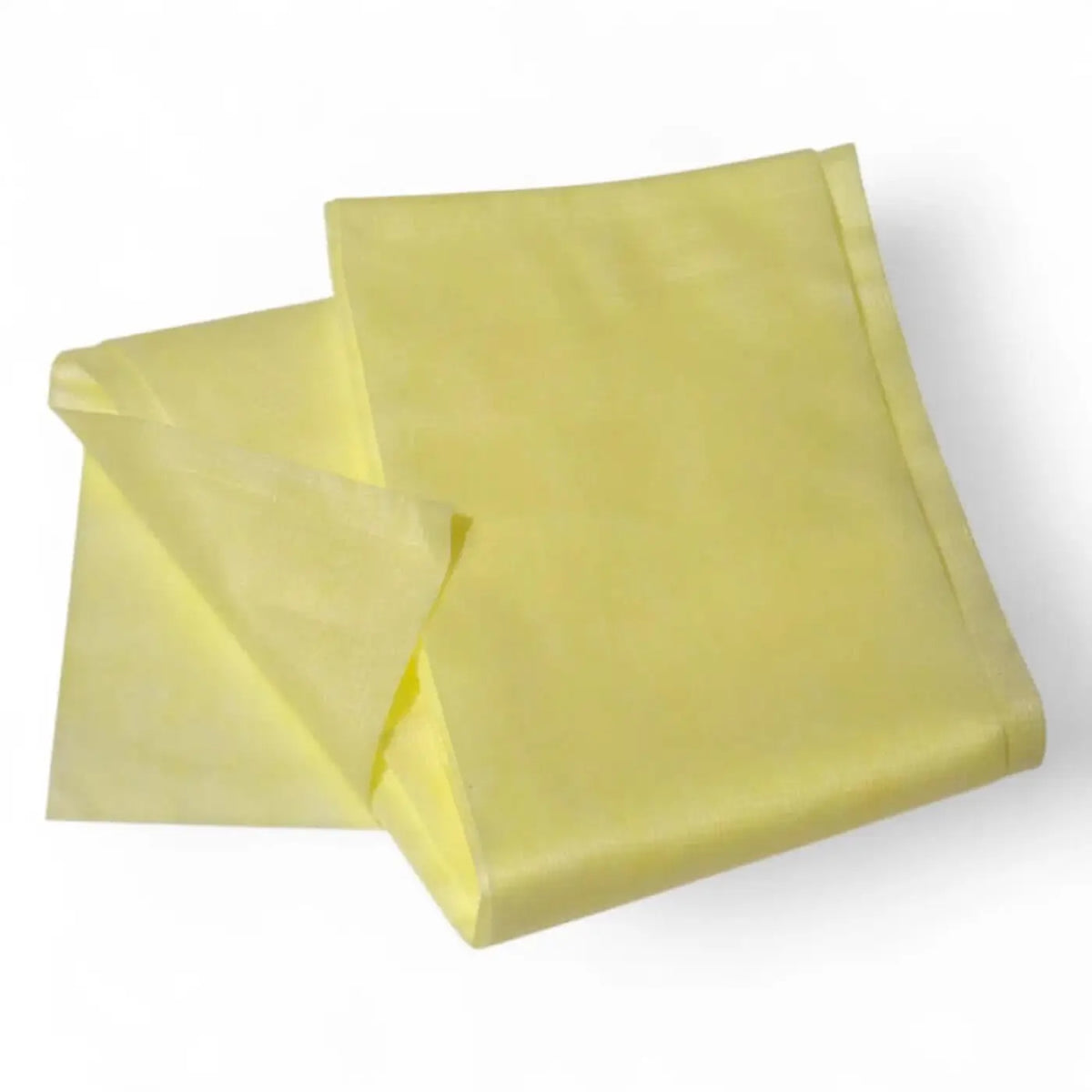 A pale yellow clendo staubbindetuch made of soft polypropylene folded neatly for dust removal