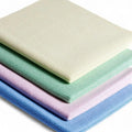 Stapel aus microfiber-reinigungstüchern floorstar microfaser-duettuch kappilar in pastellfarben creme, minzgrün, lavendel und hellblau