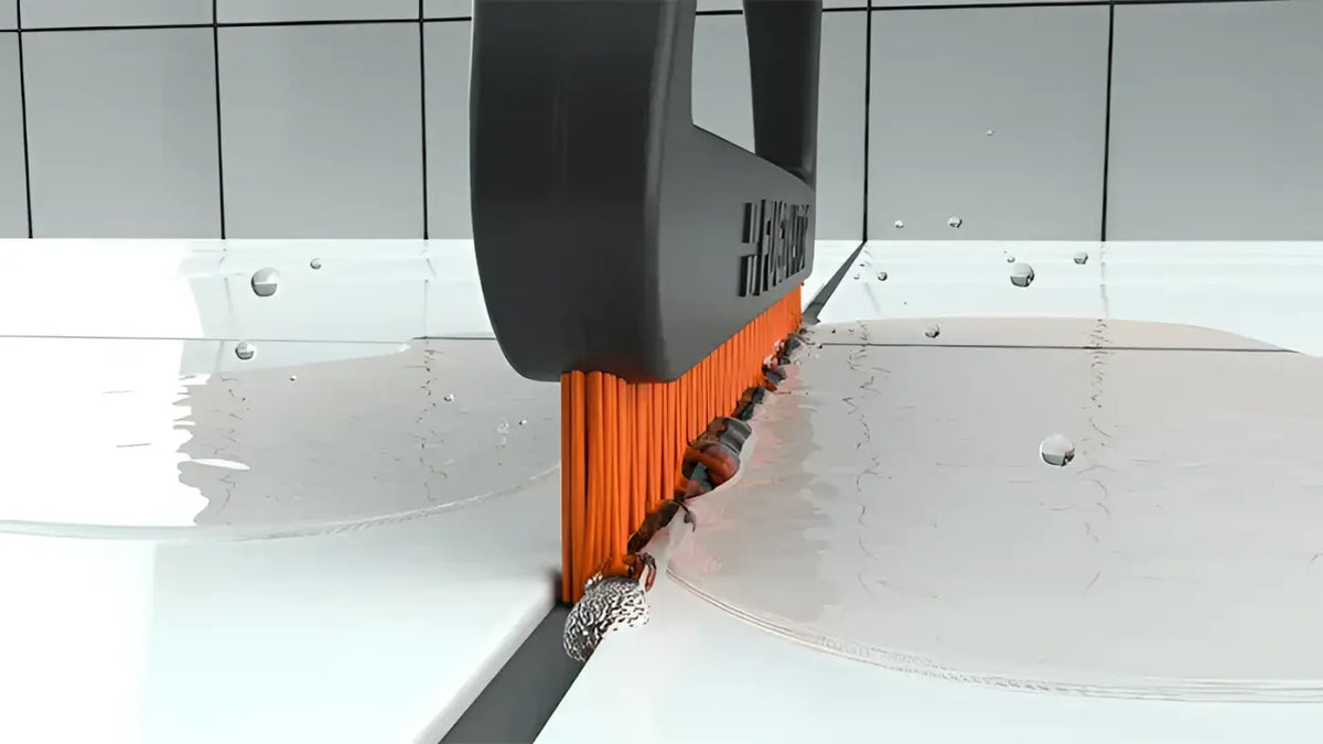 Orange bristle tile cutter mit schwarzem griff und hilti branding für fugenrecycling fuginator fugenbürste