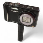 Schwarze panasonic lumix dmc-tz19 kompaktkamera mit 16x optischem zoom und texturiertem griff mit gardiner adapter aus metall und gummiplatte
