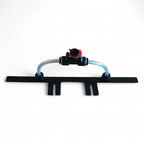 Black plastic drip irrigation emitter with transparent tubing and red valve for Gardiner Spül-Leiste rinsebar system