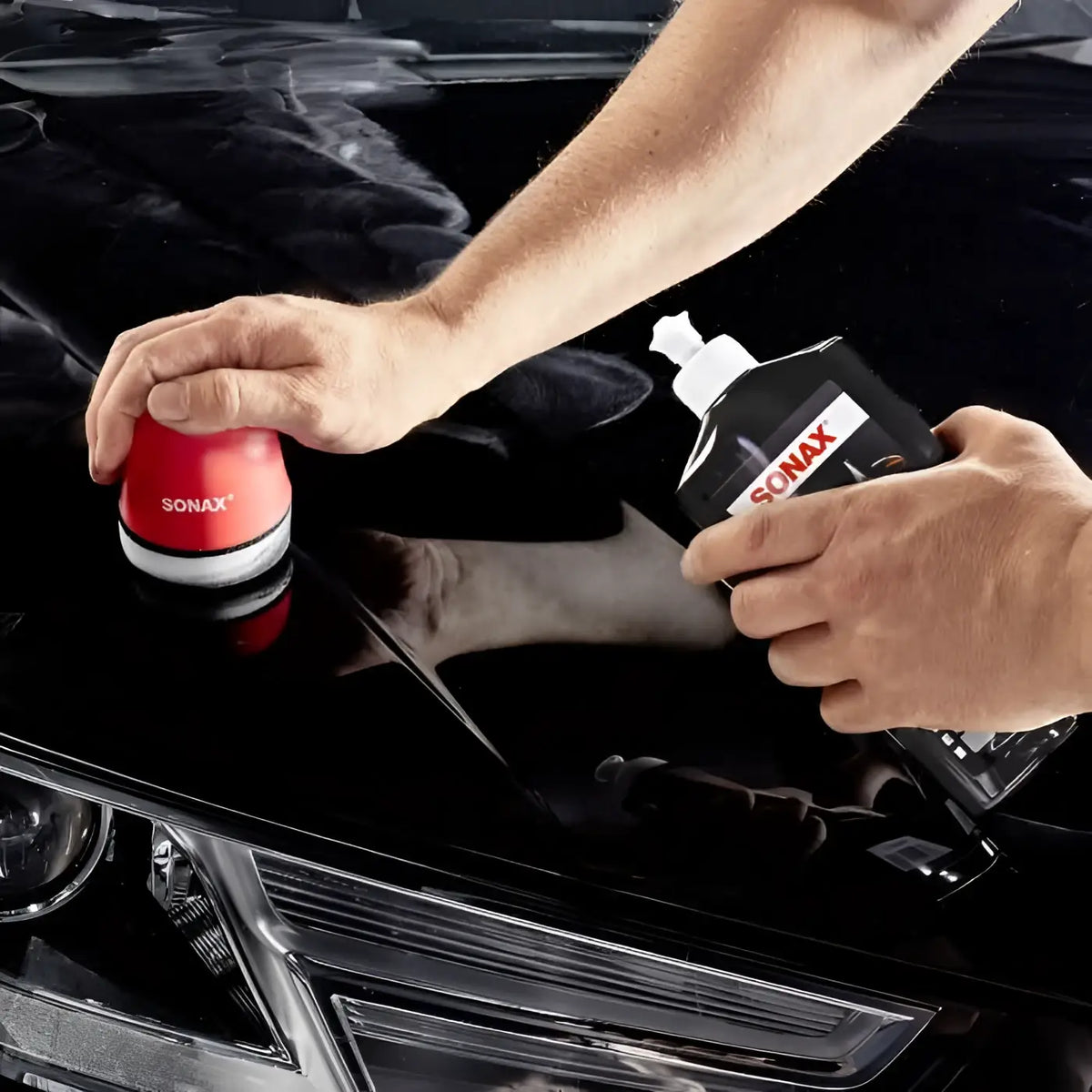 Roter sonax autopolierpad mit weißem und schwarzem gummigriff für polish und wax color 500ml
